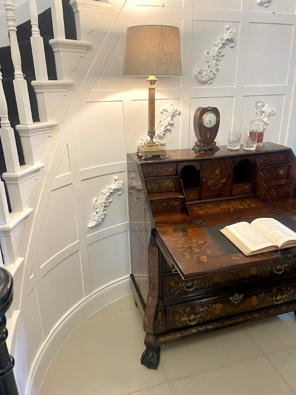 An 18th-century style mahogany bombe bureau featuring floral marquetry inlay across the slant front and drawers, complete with brass handles and carved claw feet. View II
