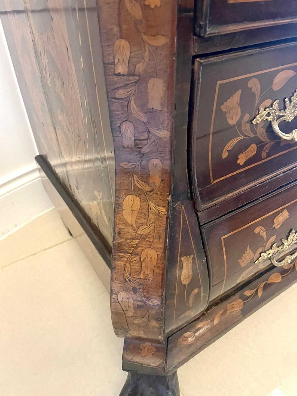 An 18th-century style mahogany bombe bureau featuring floral marquetry inlay across the slant front and drawers, complete with brass handles and carved claw feet. View XI