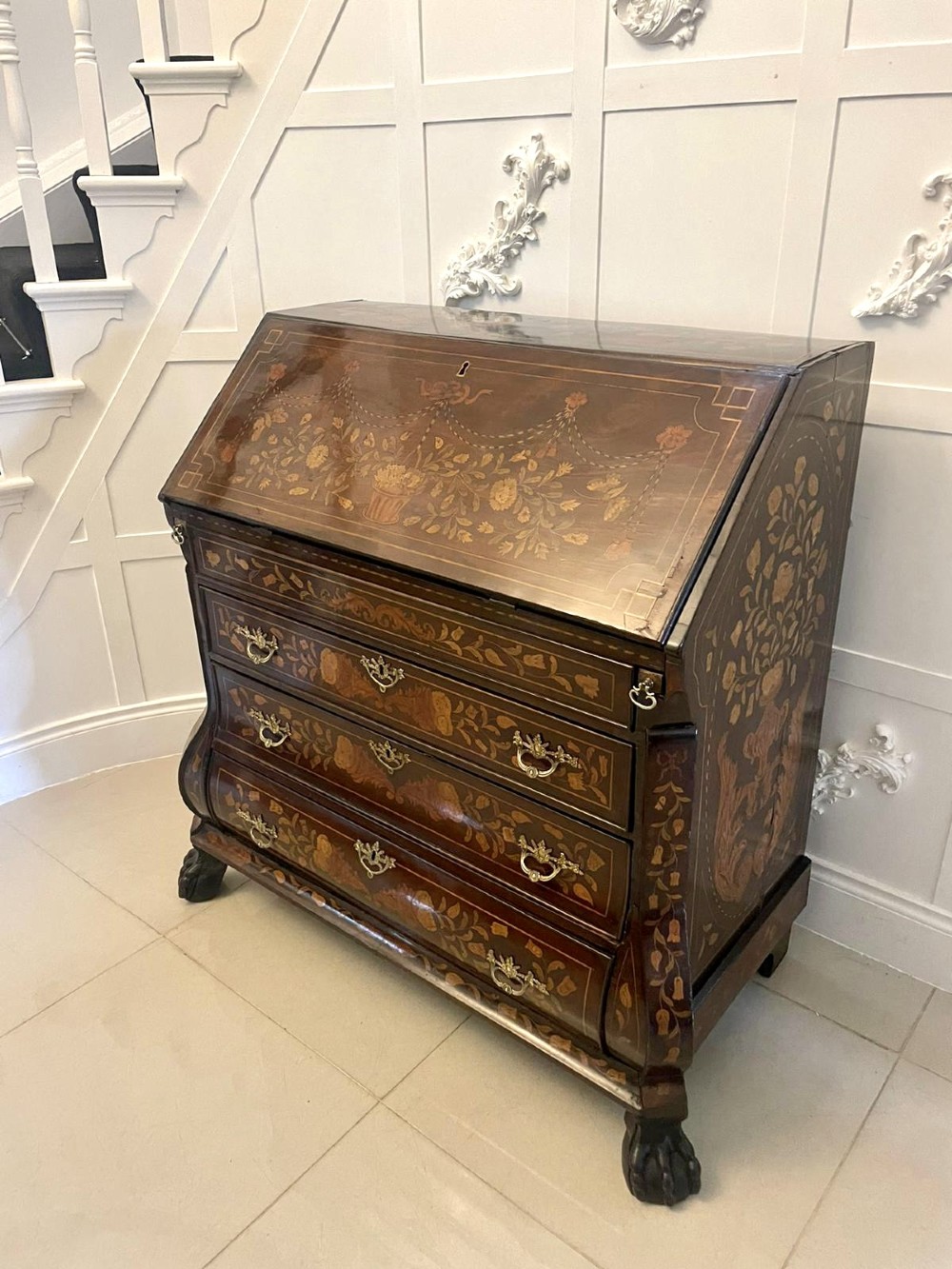 An 18th-century style mahogany bombe bureau featuring floral marquetry inlay across the slant front and drawers, complete with brass handles and carved claw feet. View XIV
