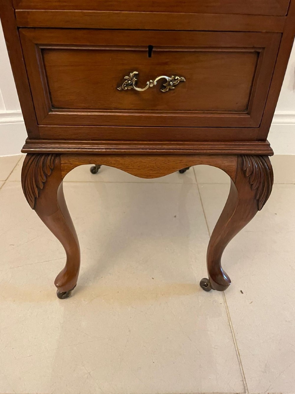 A Victorian walnut Davenport desk featuring a green leather writing slope, an upper stationery box, and carved cabriole legs on castors. View III