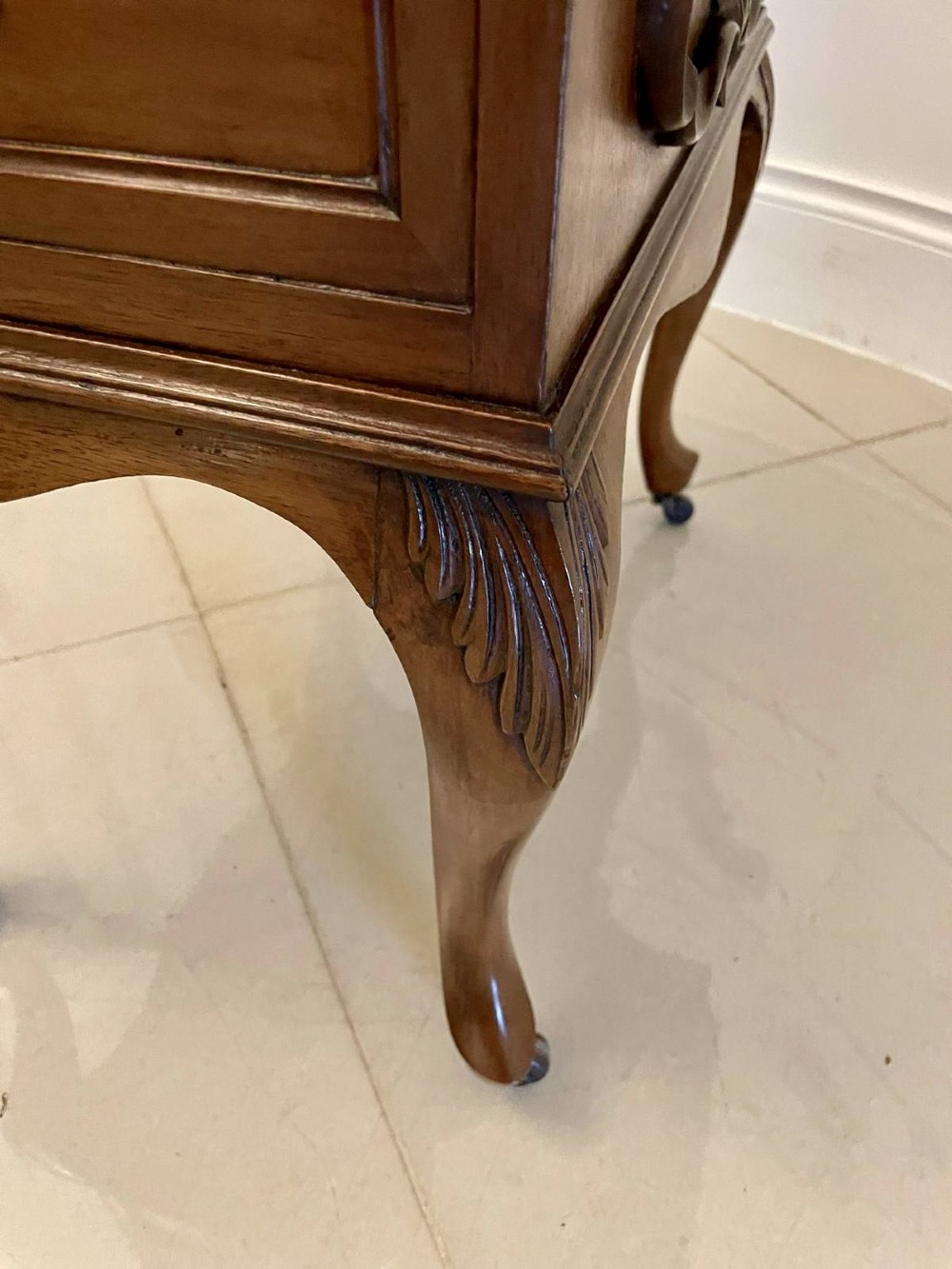 A Victorian walnut Davenport desk featuring a green leather writing slope, an upper stationery box, and carved cabriole legs on castors. View V
