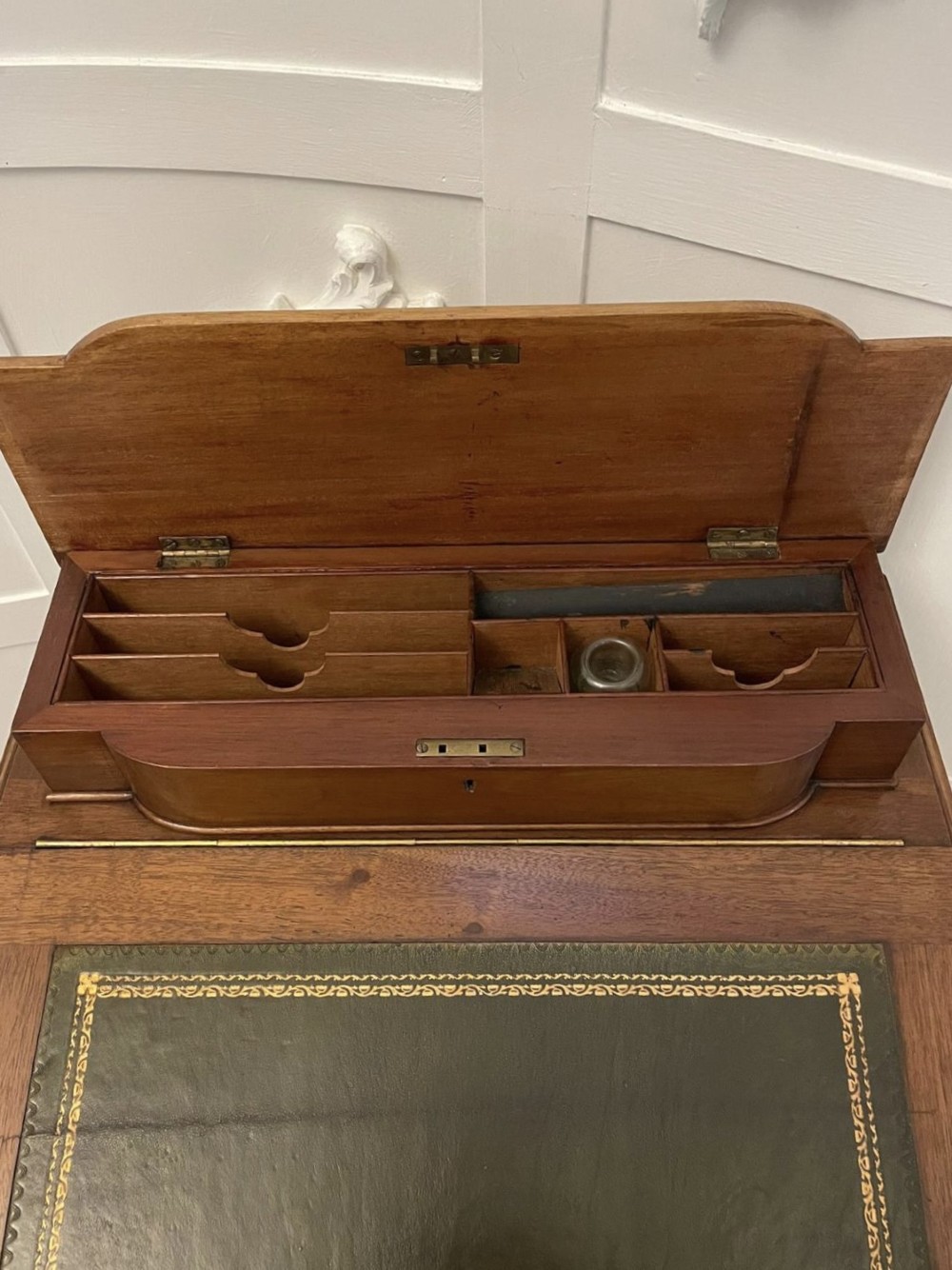 A Victorian walnut Davenport desk featuring a green leather writing slope, an upper stationery box, and carved cabriole legs on castors. View XI