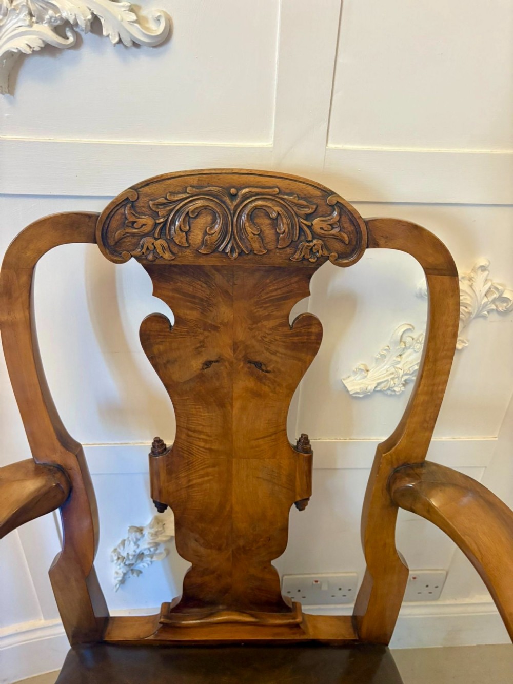A pair of carved walnut desk armchairs featuring vasiform splats, green leather seats with brass studding, and cabriole legs ending in ball and claw feet. View IX