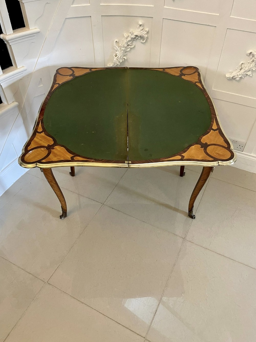 A Victorian Louis XV Revival kingwood console card table featuring a serpentine fold-over top, cabriole legs, gilt bronze mounts, and inset painted porcelain plaques. View VII