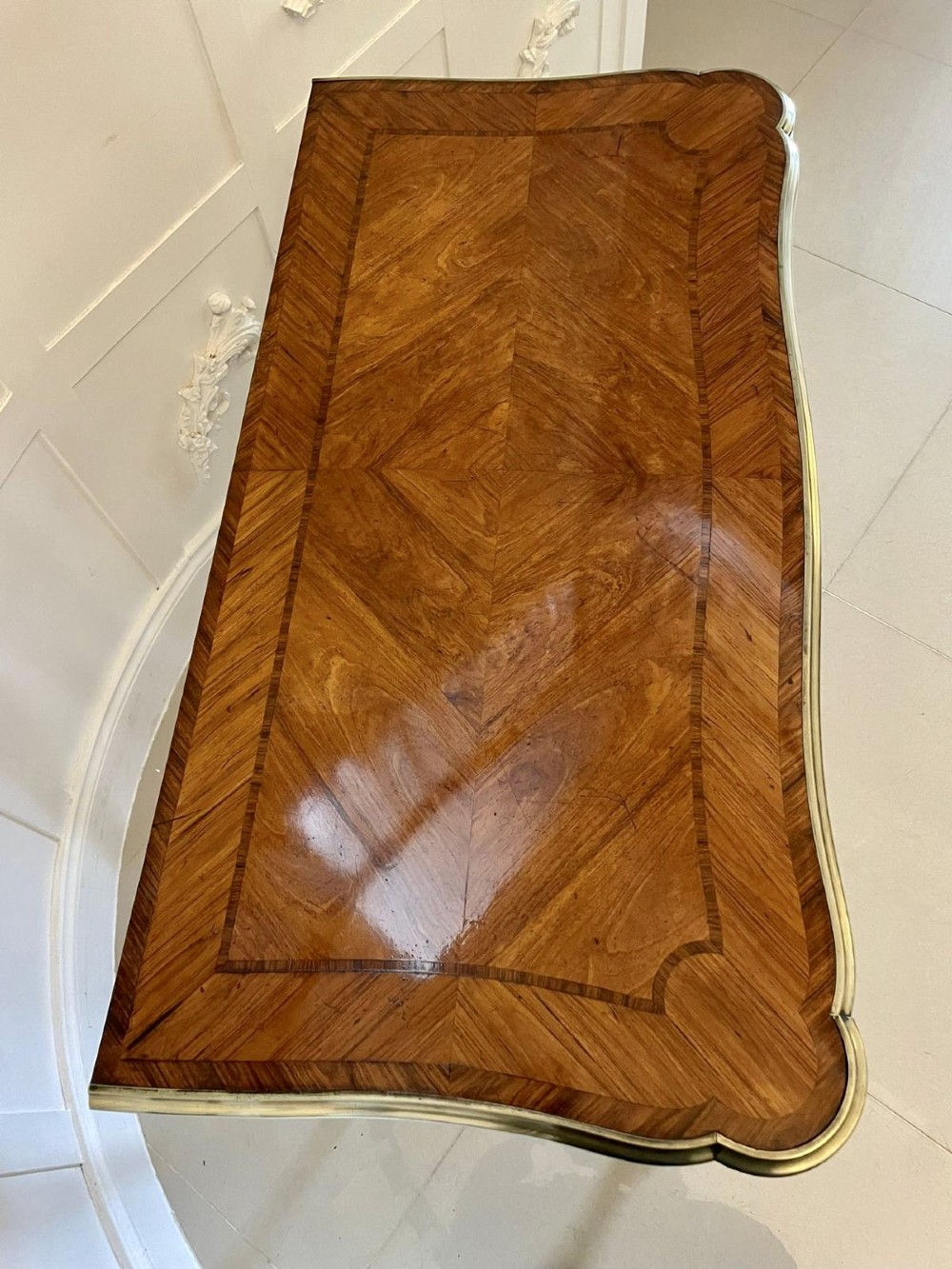 A Victorian Louis XV Revival kingwood console card table featuring a serpentine fold-over top, cabriole legs, gilt bronze mounts, and inset painted porcelain plaques. View IX