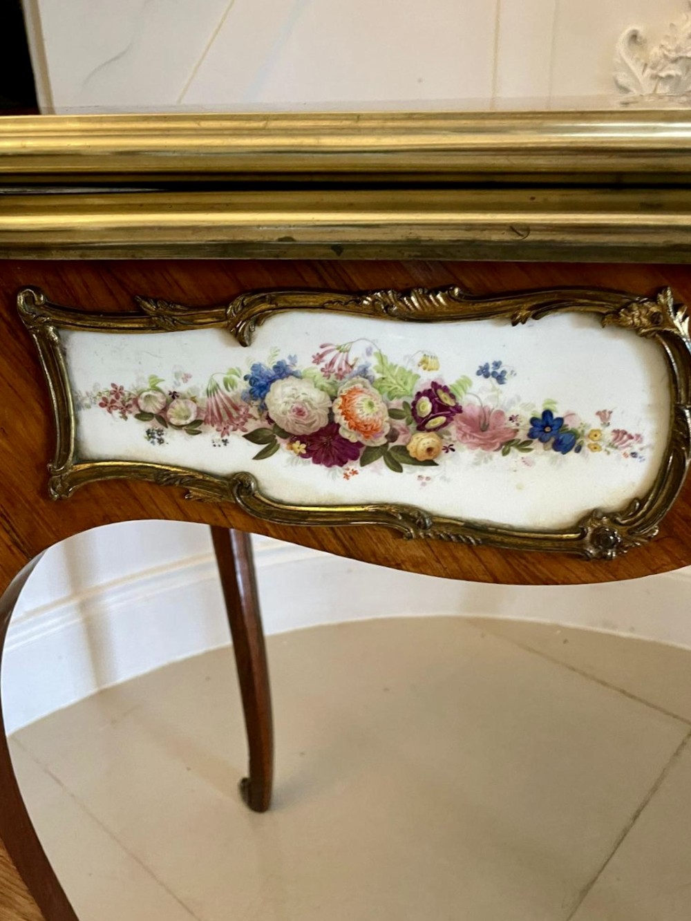 A Victorian Louis XV Revival kingwood console card table featuring a serpentine fold-over top, cabriole legs, gilt bronze mounts, and inset painted porcelain plaques. View XI