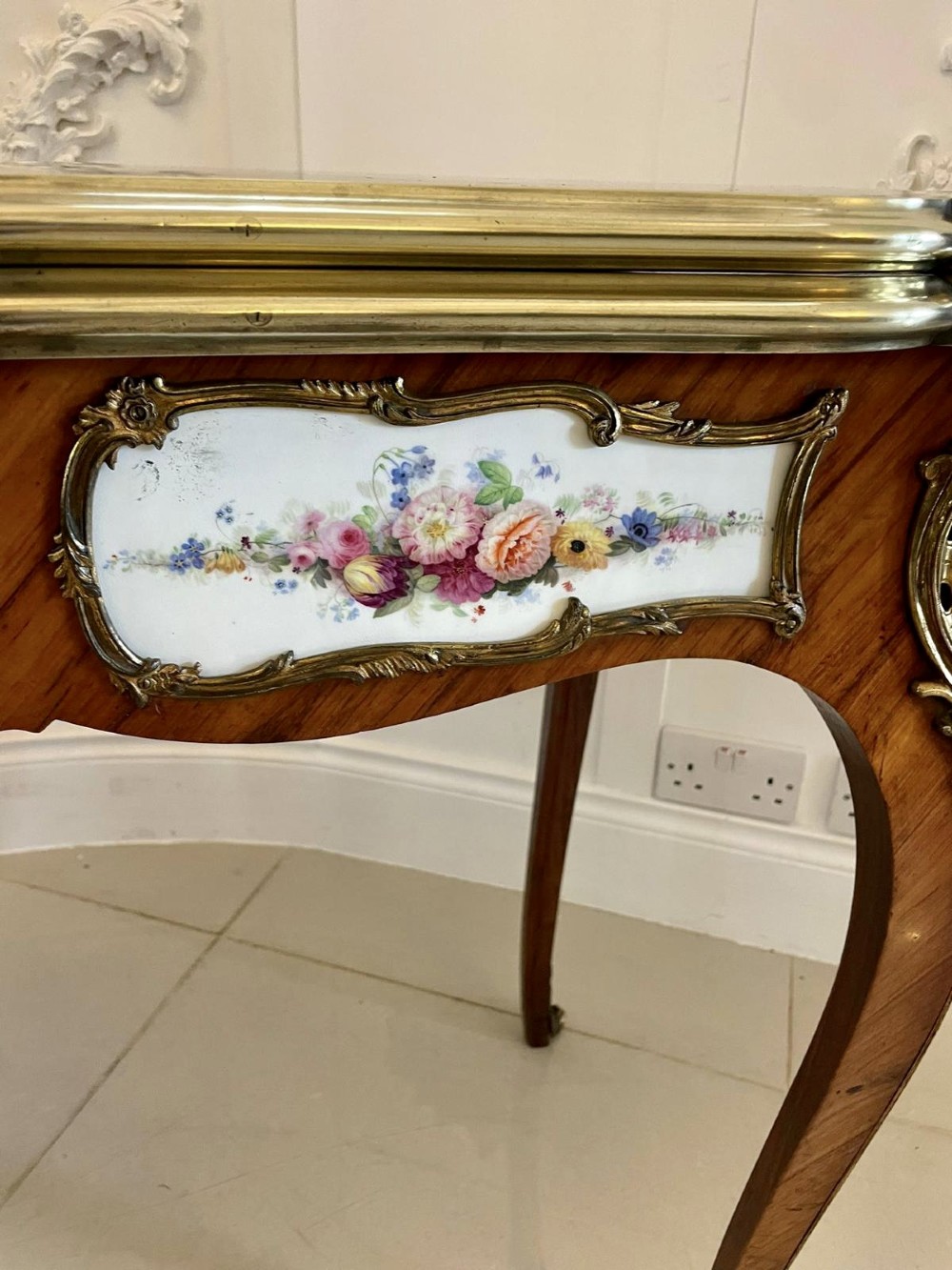 A Victorian Louis XV Revival kingwood console card table featuring a serpentine fold-over top, cabriole legs, gilt bronze mounts, and inset painted porcelain plaques. View XIII