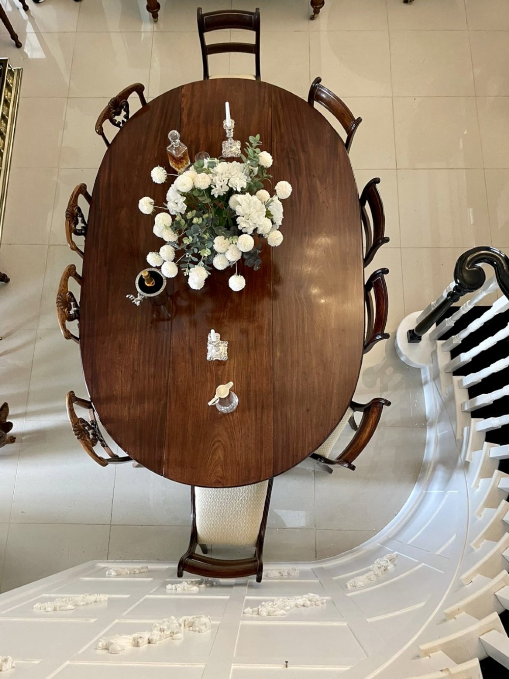 A large Georgian mahogany wake table shown with drop leaves folded down, featuring straight square legs and a polished polished timber top. View III