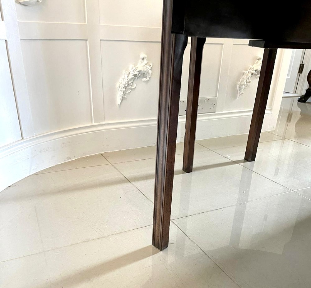 A large Georgian mahogany wake table shown with drop leaves folded down, featuring straight square legs and a polished polished timber top. View V