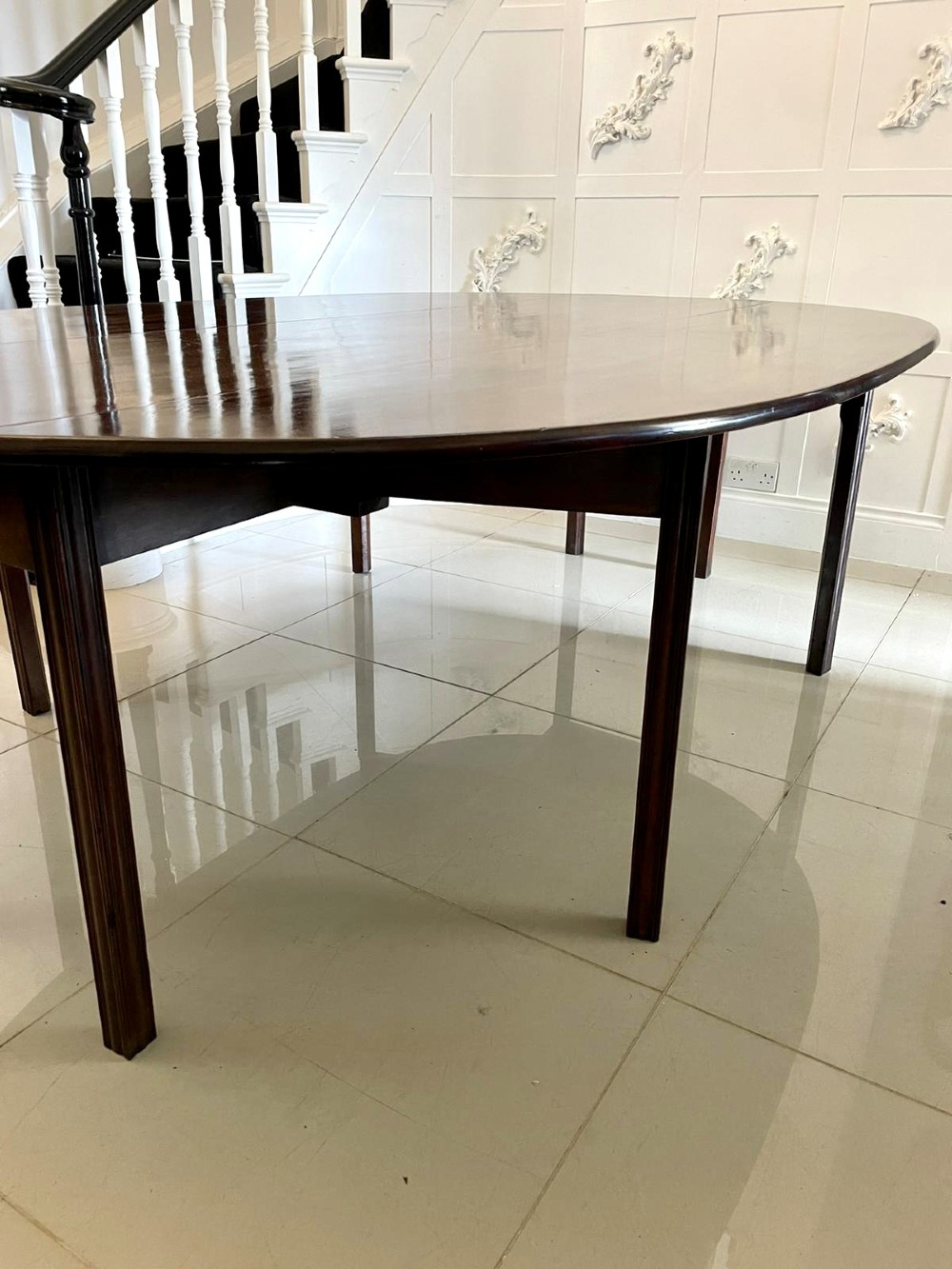 A large Georgian mahogany wake table shown with drop leaves folded down, featuring straight square legs and a polished polished timber top. View VIII