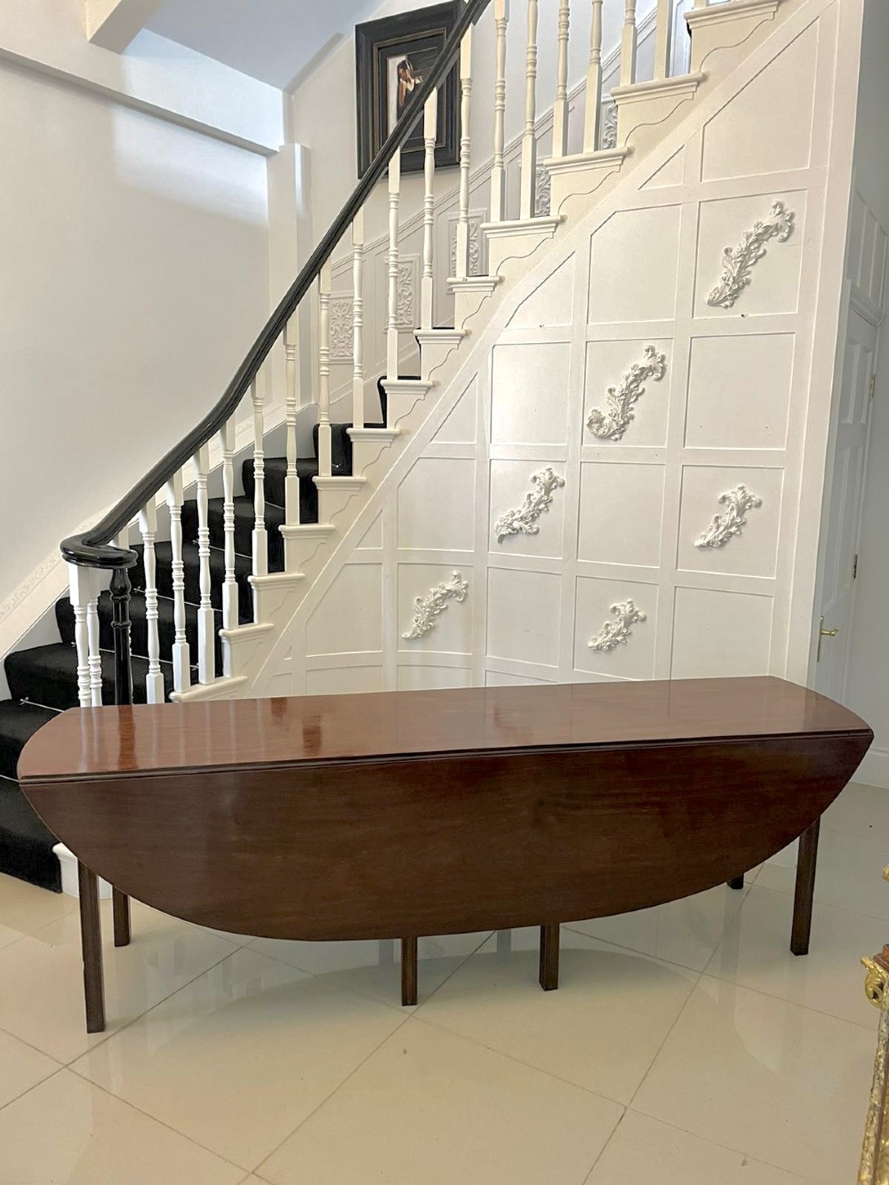A large Georgian mahogany wake table shown with drop leaves folded down, featuring straight square legs and a polished polished timber top. View XIII