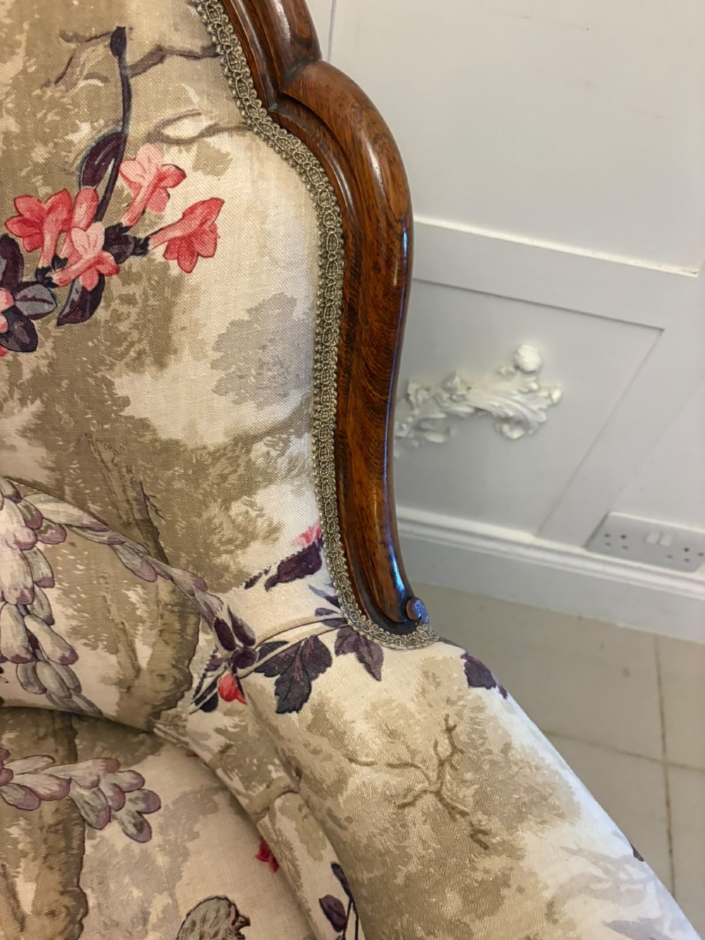 An antique Victorian carved rosewood armchair featuring floral and bird pattern upholstery with cabriole legs on castors. View XII