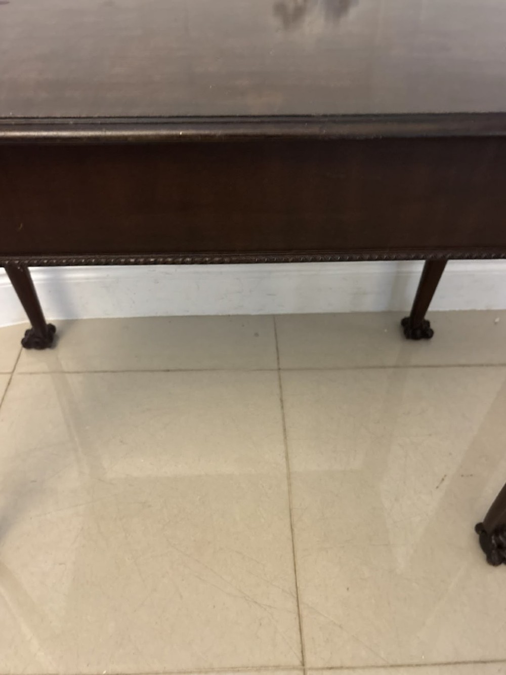 A George III mahogany centre table featuring a rectangular flat top, deep apron, and four carved legs ending in claw and ball feet. View VII