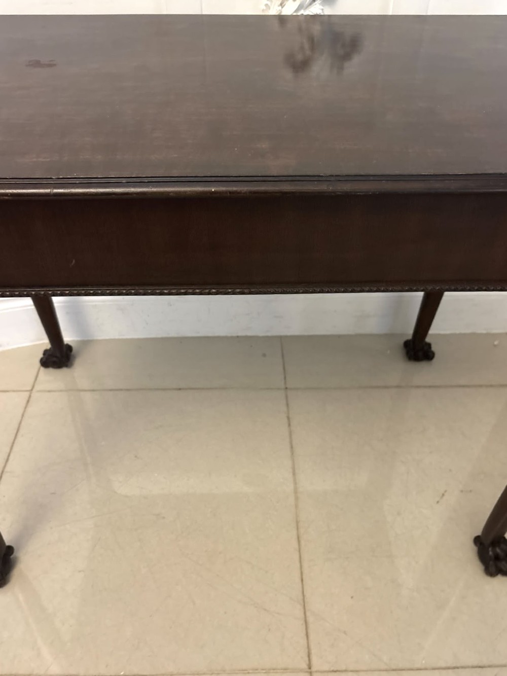 A George III mahogany centre table featuring a rectangular flat top, deep apron, and four carved legs ending in claw and ball feet. View XI