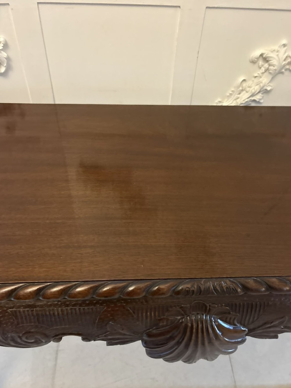 A Victorian carved mahogany console table featuring cabriole legs with ball and claw feet, a shell-carved central apron, and a gadrooned top border. View II