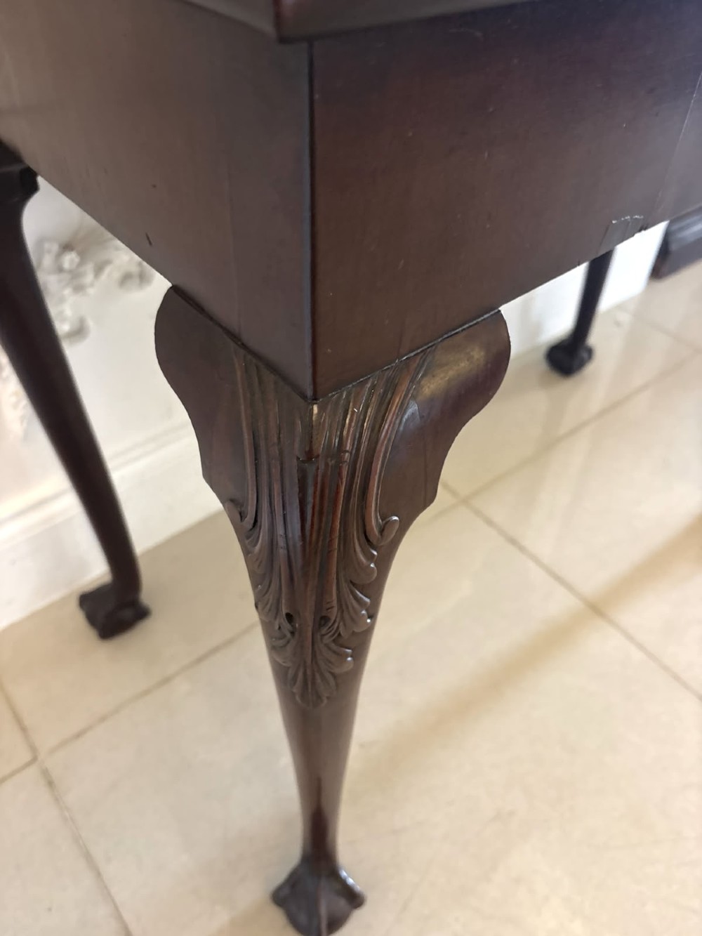 A Victorian carved mahogany console table featuring cabriole legs with ball and claw feet, a shell-carved central apron, and a gadrooned top border. View XIV