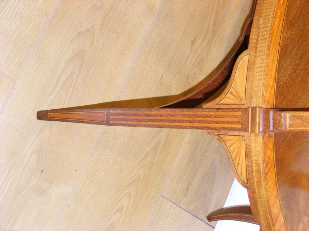 An Edwardian oval mahogany two-tier occasional table with delicate satinwood inlay and curved legs. View VIII