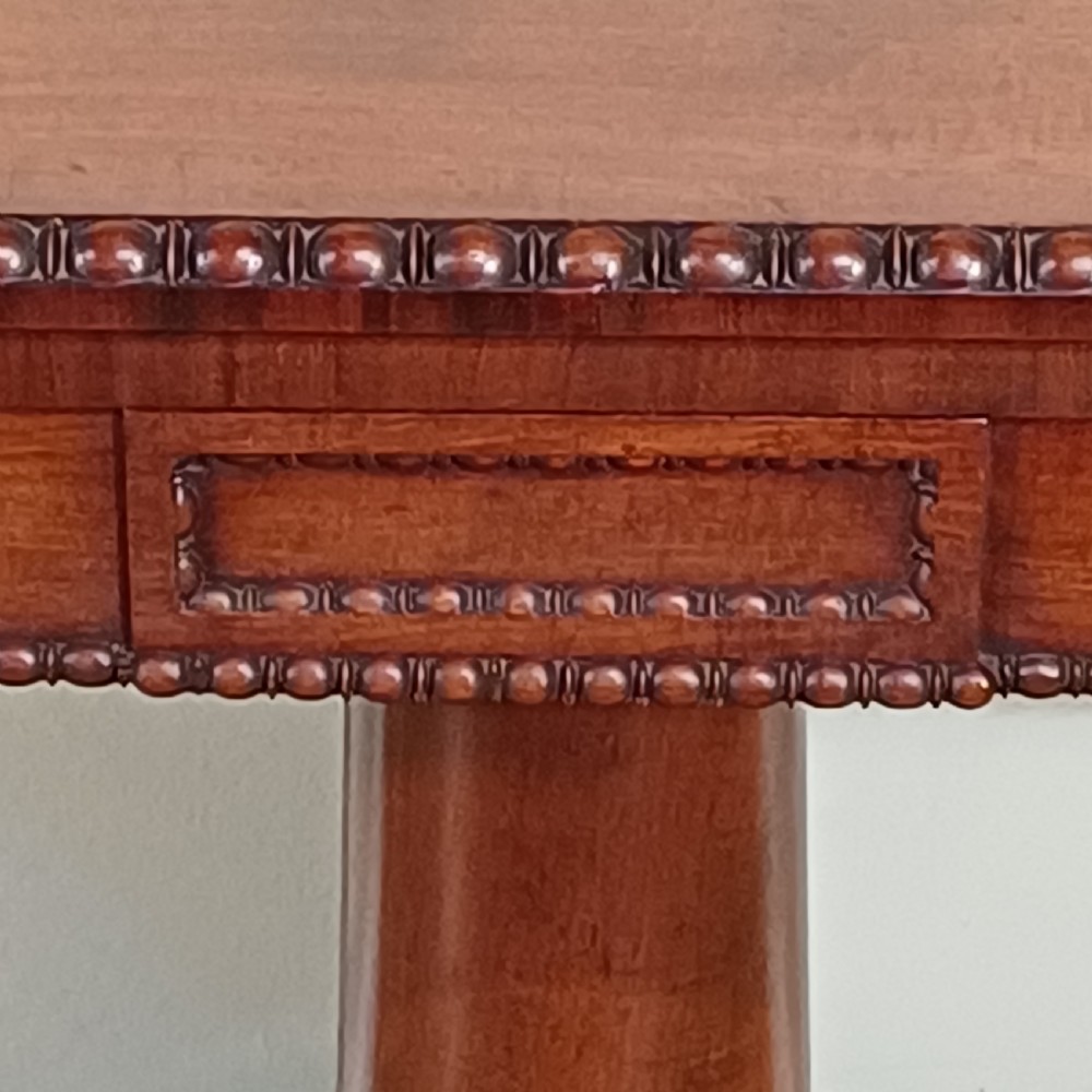 A 19th-century mahogany bookcase featuring two glazed doors, adjustable interior shelves, and a plinth base. View IX
