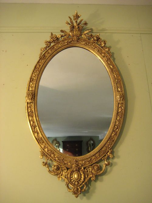 oval gilt wall mirror - CATEGORY: ANTIQUE MIRRORS - DATED 1880