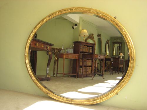 19TH CENTURY ENGLISH LARGE OVAL GILT WALL MIRROR - ADDITIONAL PHOTO 1