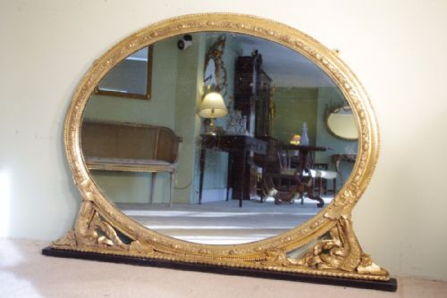 english gilt oval dolphin overmantle mirror - CATEGORY: ANTIQUE MIRRORS - DATED 1880
