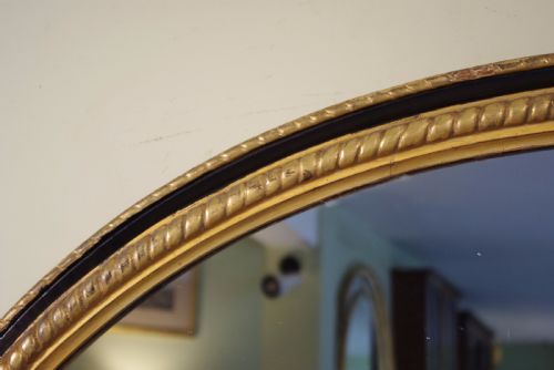 LARGE OVAL EBONISED AND PARCELGILT OVERMANTLEWALL MIRROR - ADDITIONAL PHOTO 3