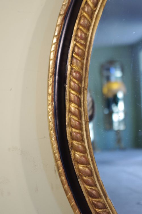 LARGE OVAL EBONISED AND PARCELGILT OVERMANTLEWALL MIRROR - ADDITIONAL PHOTO 5
