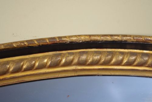 LARGE OVAL EBONISED AND PARCELGILT OVERMANTLEWALL MIRROR - ADDITIONAL PHOTO 7