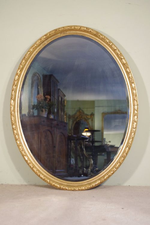 large oval gilt wall mirror - CATEGORY: ANTIQUE MIRRORS - DATED 1880