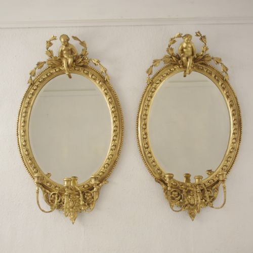pair of victorian gilt oval girandole mirrors with putto cresting - CATEGORY: ANTIQUE MIRRORS - DATED 1880