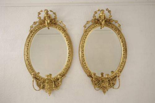 PAIR OF VICTORIAN GILT OVAL GIRANDOLE MIRRORS WITH PUTTO CRESTING - ADDITIONAL PHOTO 1