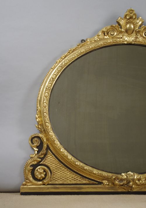VICTORIAN GILT AND EBONISED OVAL OVERMANTLE MIRROR - ADDITIONAL PHOTO 1