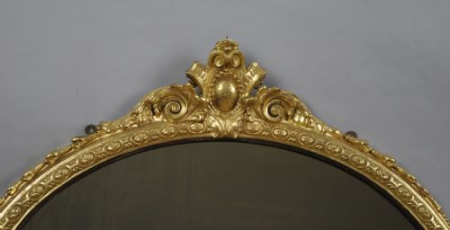 VICTORIAN GILT AND EBONISED OVAL OVERMANTLE MIRROR - ADDITIONAL PHOTO 3