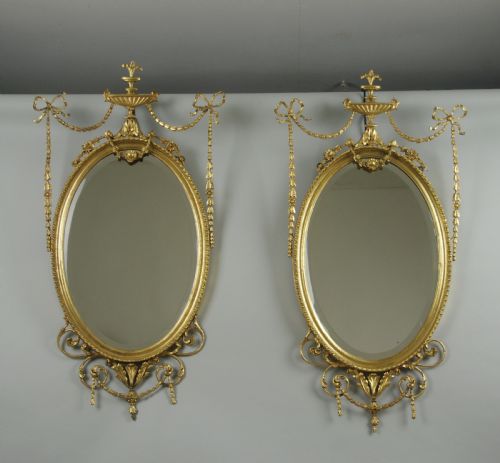 PAIR OF VICTORIAN GILT ADAM STYLE OVAL WALL MIRRORS