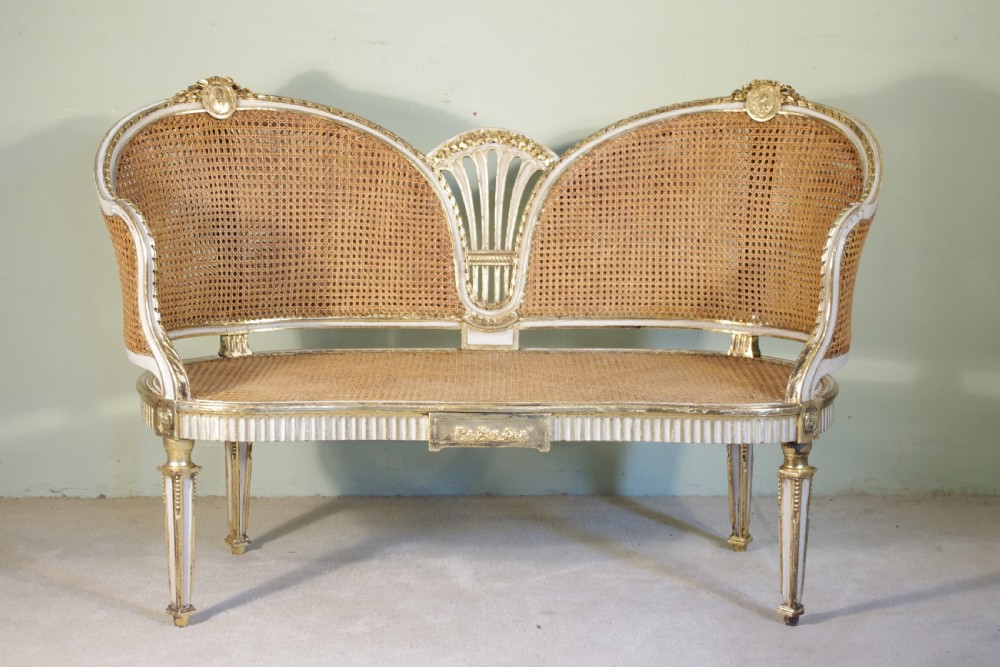 French Painted and Parcel-Gilt  Two Seater Cane Sofa