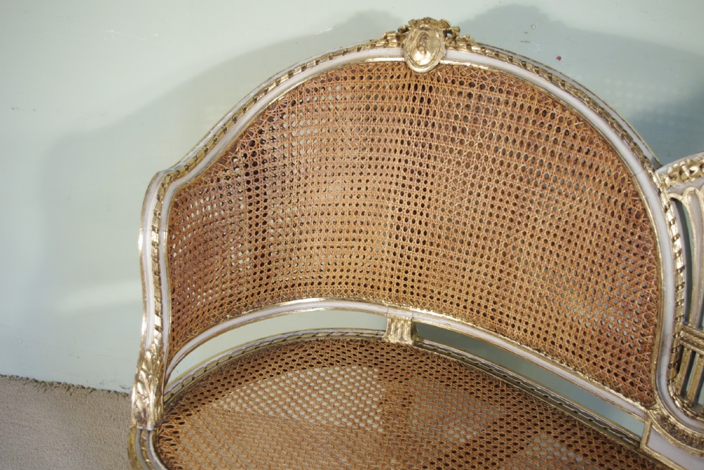 French Painted and Parcel-Gilt  Two Seater Cane Sofa View VII