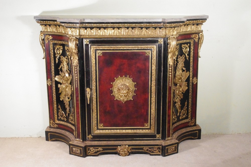 A 19th-century French ebonised side cabinet featuring gilt-metal mounts, a central red panel with a classical medallion, and a contoured marble top. View II