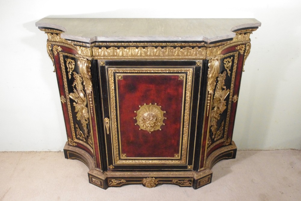 A 19th-century French ebonised side cabinet featuring gilt-metal mounts, a central red panel with a classical medallion, and a contoured marble top. View III