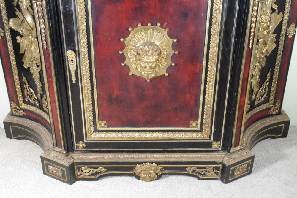 A 19th-century French ebonised side cabinet featuring gilt-metal mounts, a central red panel with a classical medallion, and a contoured marble top. View XII