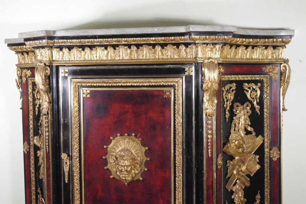 A 19th-century French ebonised side cabinet featuring gilt-metal mounts, a central red panel with a classical medallion, and a contoured marble top. View XIII