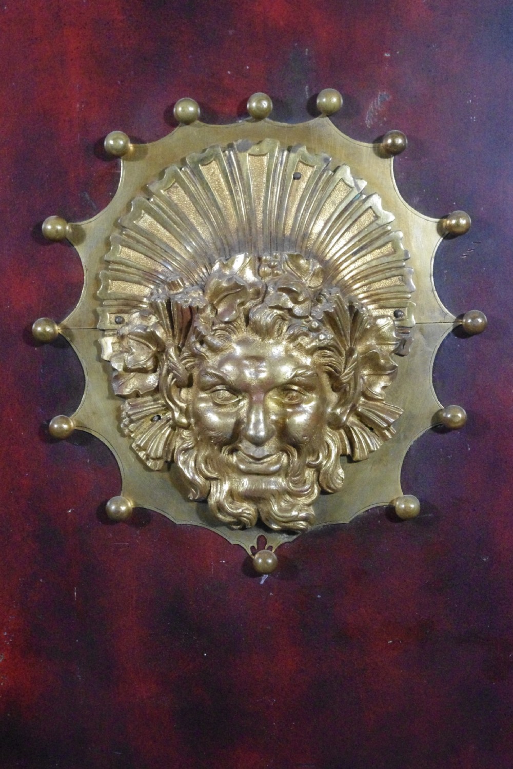 A 19th-century French ebonised side cabinet featuring gilt-metal mounts, a central red panel with a classical medallion, and a contoured marble top. View XX