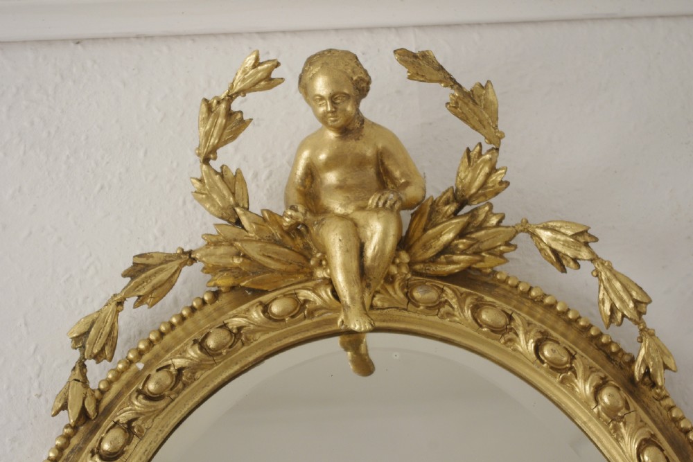 Pair of Victorian Gilt Oval Girandole  Mirrors with Putto Cresting View V