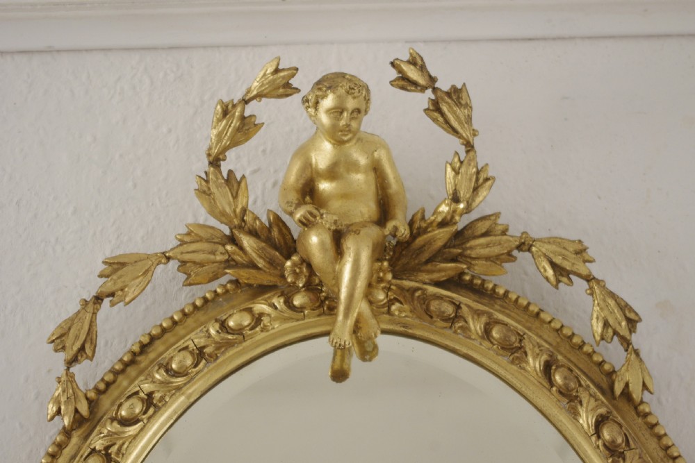 Pair of Victorian Gilt Oval Girandole  Mirrors with Putto Cresting View VI