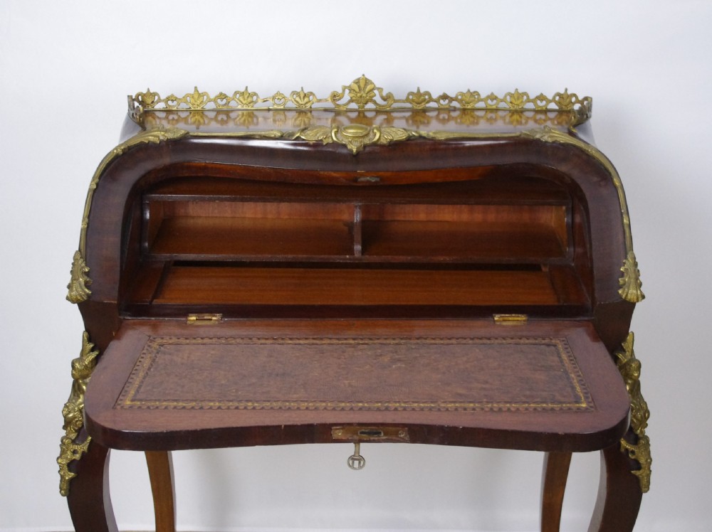 A French Louis XV style bureau de dame constructed from burr walnut veneer with cabriole legs and ornate gilt metal mounts. View VIII