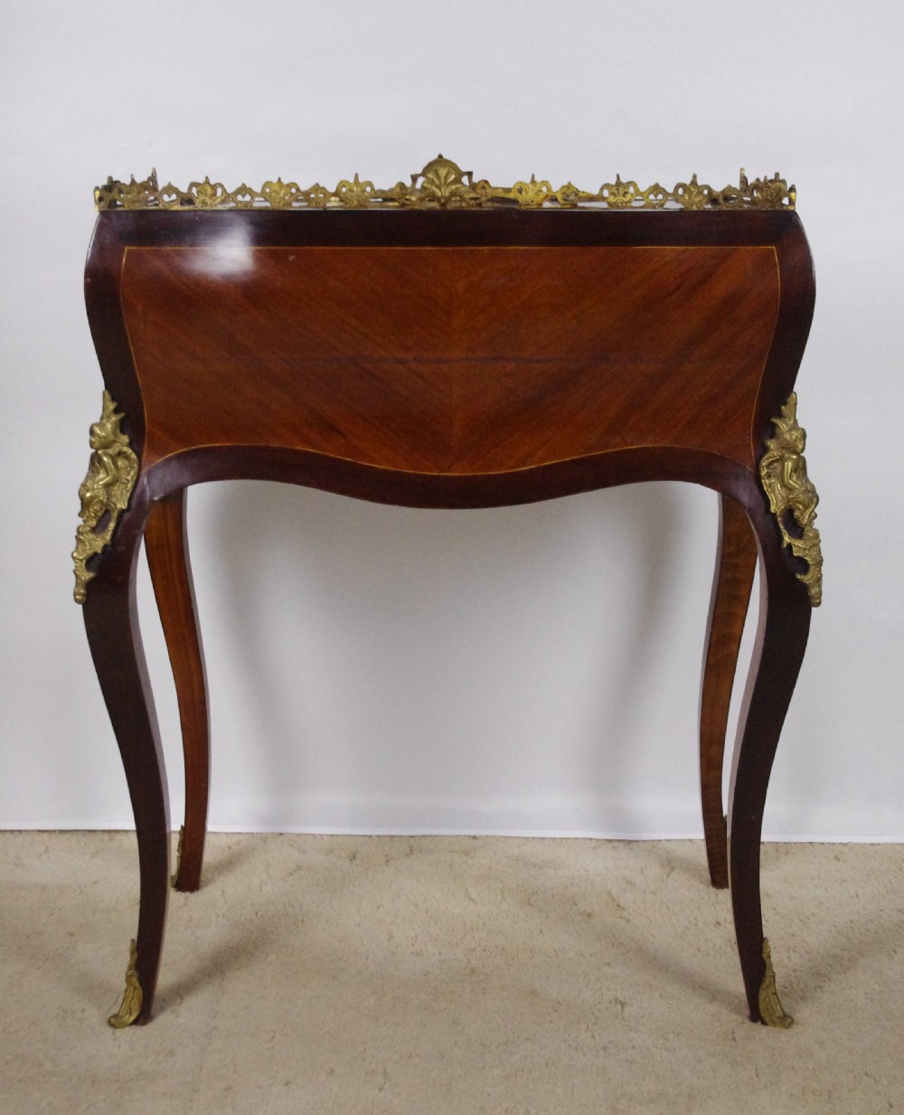A French Louis XV style bureau de dame constructed from burr walnut veneer with cabriole legs and ornate gilt metal mounts. View XIV