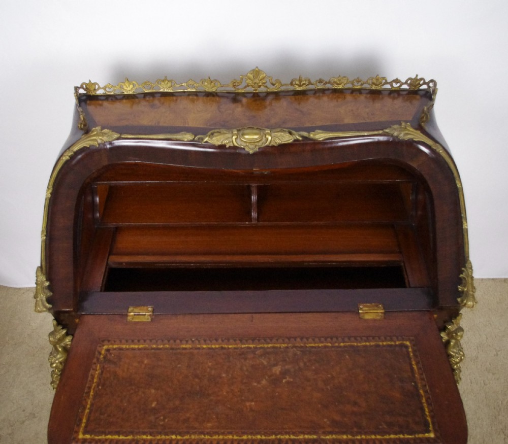 A French Louis XV style bureau de dame constructed from burr walnut veneer with cabriole legs and ornate gilt metal mounts. View XIX