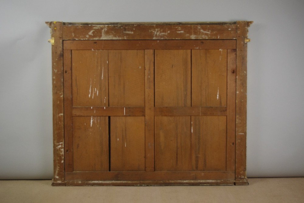 A large rectangular Victorian gilt overmantel mirror featuring Neoclassical swags, rosettes, and beaded moulding along the frame. View XI