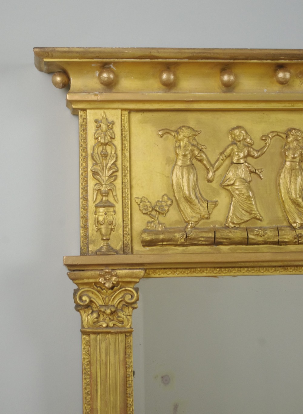 A rectangular Victorian giltwood overmantel mirror with a classical figure frieze and fluted side columns. View III