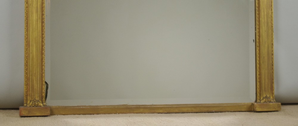 A rectangular Victorian giltwood overmantel mirror with a classical figure frieze and fluted side columns. View VII