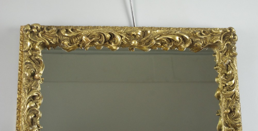 A rectangular Victorian wall mirror featuring an ornate gold giltwood frame with detailed scrollwork moulding. View III